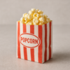 L’image avec le sac rouge/blanc rayé rempli de popcorn (visuel marketing)
